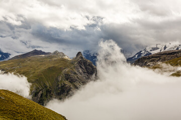 Panorama of cloud layer from mountain top over Swiss alps