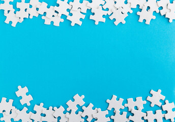 Pieces of jigsaw puzzle on blue background