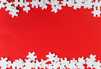 Pieces of jigsaw puzzle on red background