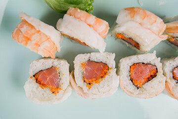 a Japanese roll with shrimp and salmon with white rice