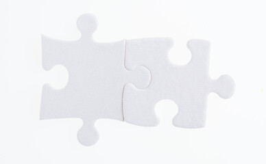 Two puzzle pieces on white background