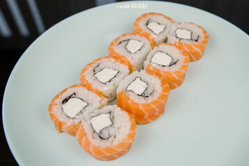 sushi roll philadelphia with salmon on a plate japanese cuisine