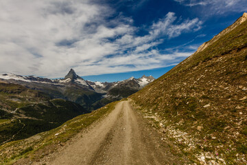 Amazing view of touristic trail near the Matterhorn in the Swiss Alps.