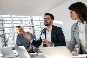 Group of business people at the conference.They discuss and participate in future business presentations.	
