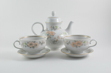 vintage ceramic teapot with cups on a white background.tea ceremony.