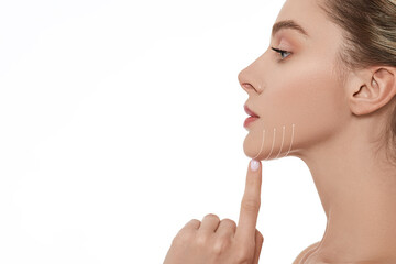 Beautiful woman with perfect skin with lifting arrows on chin line, isolated, side view. Cosmetology procedure for beautiful and elastic face contour