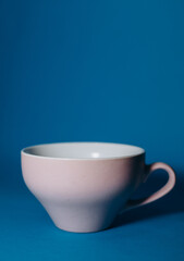 pink cup on a blue background