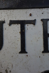 Written Wording in Distressed Typography Found Letter T