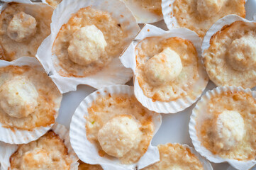 Plate with delicacy roasted scallops with cheese