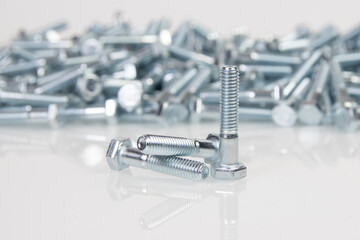 metal bolts on a white background. engineering fasteners