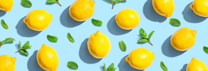 Fresh yellow lemons with mints overhead view - flat lay