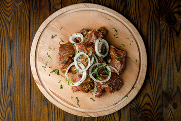 meat culinary products on a wooden board
