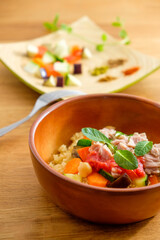 couscous with tuna, peppers, aubergine and courgettes, traditional dish of Moroccan cuisine
