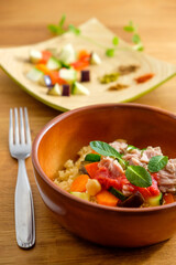 couscous with tuna, peppers, aubergine and courgettes, traditional dish of Moroccan cuisine