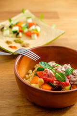 couscous with tuna, peppers, aubergine and courgettes, traditional dish of Moroccan cuisine