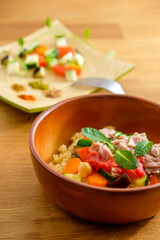couscous with tuna, peppers, aubergine and courgettes, traditional dish of Moroccan cuisine