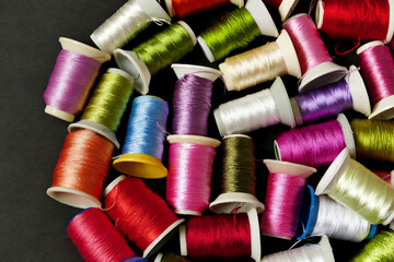 close-up colorful threads,craft threads,colorful lace knitting threads wound on spools,