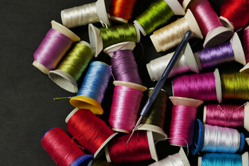 close-up colorful threads,craft threads,colorful lace knitting threads wound on spools,