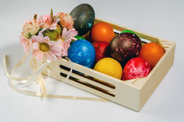Easter, a composition of colored eggs in a box