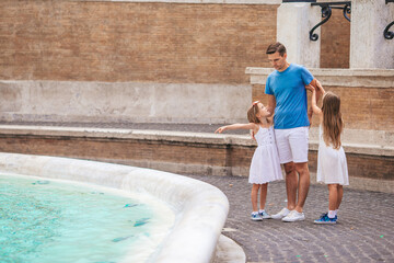 Happy kids and dad enjoy their european vacation in Italy - 495970512