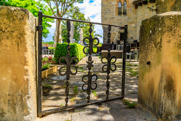 Ornate wooden gate with metal accents in old town Casco Viejo in Pamplona, Spain