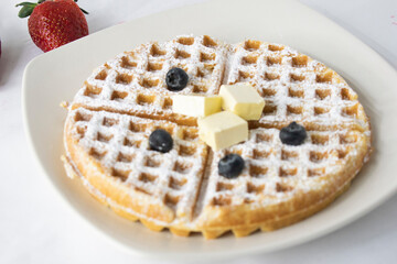 Waffle with butter and blueberry