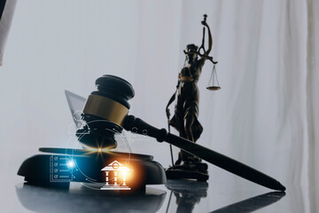 Justice and law concept. Gavel on sounding block in hand's Male judge at a courtroom, working with document law books, report the case on table in modern office.