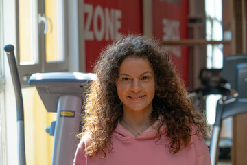 Hot steamy gym session with curly brunette toned female model