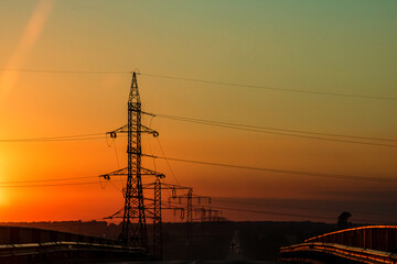 Electric power pylon, electric tower at sunset