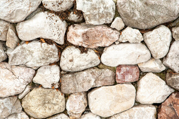 Stone wall from big stones for background design. A backing with natural stones for branding, calendar, card, screensaver, wallpaper, poster, banner, cover, website. A place for your design or text
