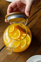 teapot with tea on a wooden table in a premium restaurant

