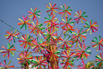 Numerous Colorful Paper Spinners spinning