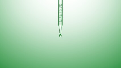 Macro shot of graduated chemical dropper with clear transparent liquid dripping from it on green...