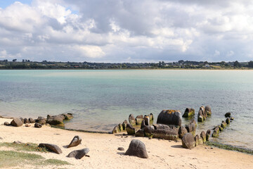 Fototapeta na wymiar Ruins of the Dolmen of Guinirvit, Bay of Kernic, Plouescat, Finistere, Brittany, France
