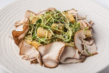 Salad with meat in a plate, restaurant, food photography