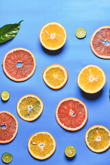 citrus slices, orange, grapefruit, lemon on blue background- Fresh fruits. Natural fruits.