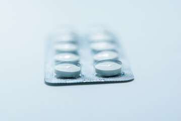 Tablets, pills in blister packs, drugs, macro, selective focus. Isolated on white...