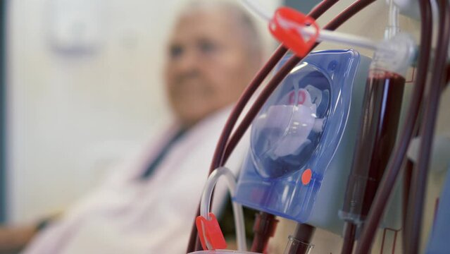 Hardware Hemodialysis. An elderly person, a patient connected to a blood assessment machine.