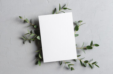 Wedding invitation or greeting card mockup with natural eucalyptus twigs