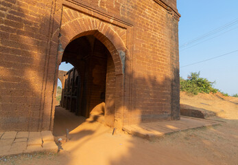 Large gateway - a fine arched gateway , popularly known as "Pathar darwaja" in Hindi , is made with dressed laterite blocks. It is a famous tourist spot in Bishnupur, West Bengal, India.