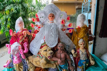 Kolkata, West Bengal, India - 7th October 2018 : Clay idol of Goddess Durga with white dress, under...