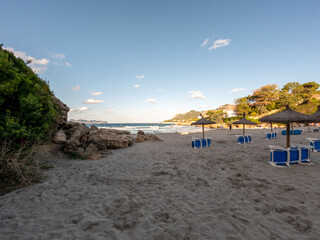 Beach with white sand and turquoise water of the Mediterranean sea in Alcudia, Mallorca, or Majorca, Balearic Islands, Spain