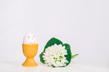 happy easter egg with flowers of snowdrop