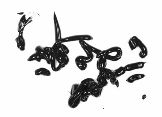 Black paint, drops wet dye for painting and making art isolated on white, top view