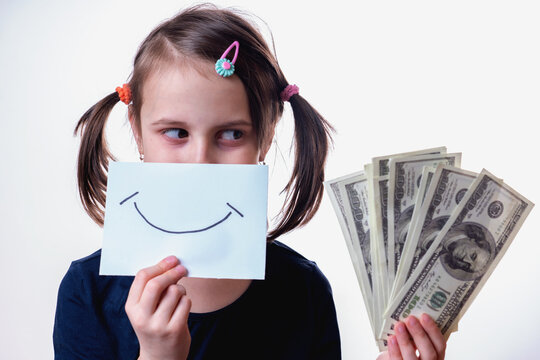 Conceptual image: making money and good business. Beautiful happy young girl holding US Dollar bills.