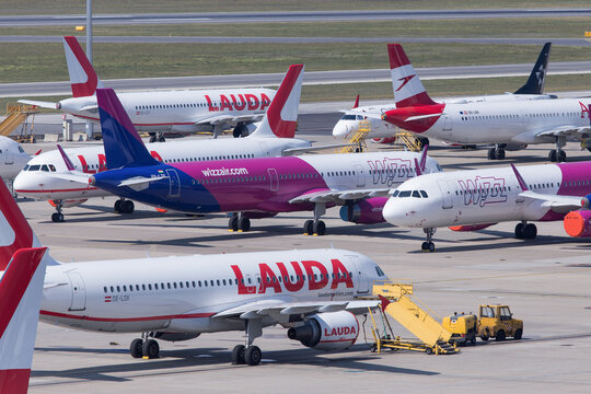 Airport ramp full with airplanes of competitors Ryanair, Lauda, Wizzair and Austrian Airlines