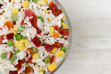 Frozen mixture of rice and vegetables, food background, close-up
