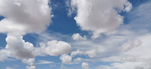 blue sky background with tiny clouds