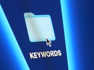 Keywords - macro shot of folder on computer desktop with mouse pointer - zooming in on screen pixels