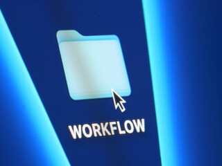 Workflow - macro shot of folder on computer desktop with mouse pointer - zooming in on screen pixels